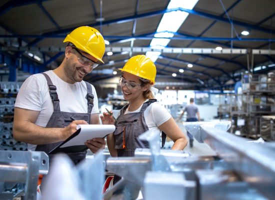 Manufacturing Units 7 factory-workers-analyzing-production-results-large-industrial-hall_342744-165