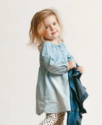 full-length-portrait-cute-little-kid-girl-stylish-jeans-clothes-smiling-standing-white-kids-fashion-concept_155003-20299